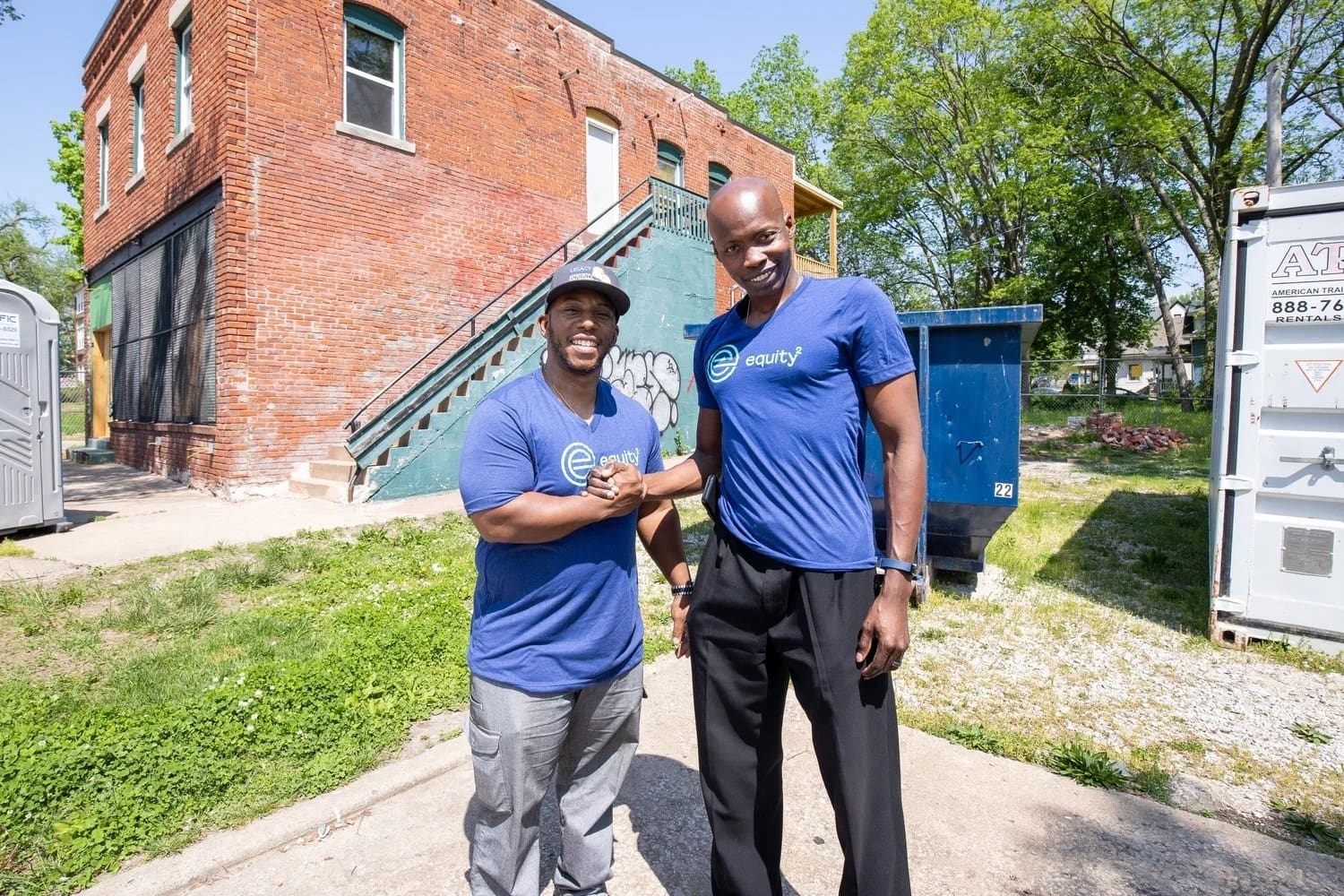 Two men of color shaking hands