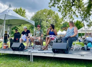 Image shows a panel of two women and four men at the Kansas City Ameri'kana festival.