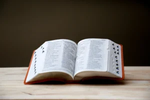 An open dictionary on a wooden table